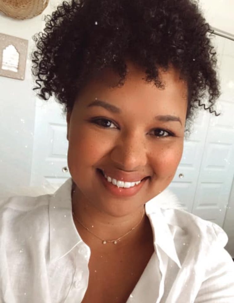 Michelle Rohr smiling in a white shirt